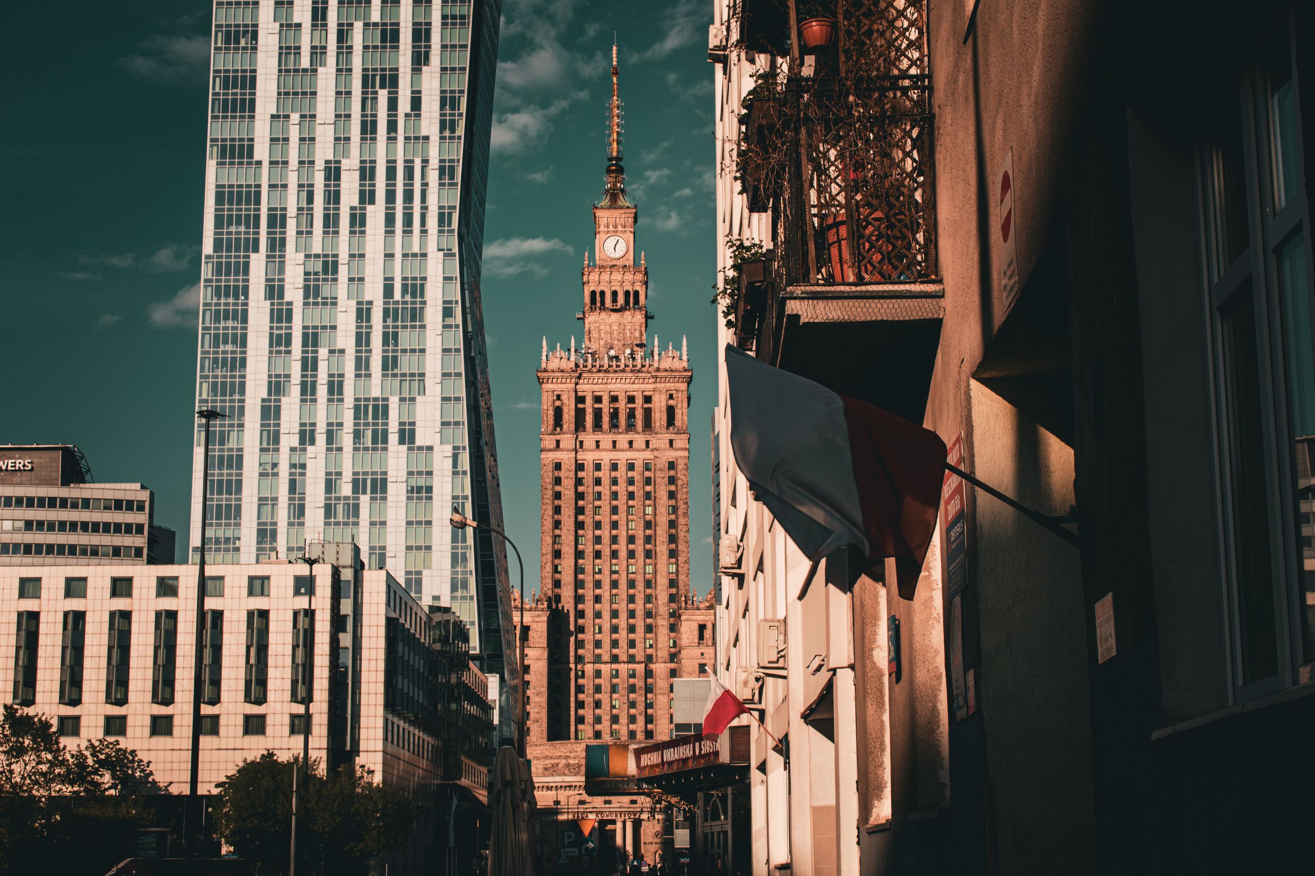 Stunning Warsaw cityscape showcasing the iconic Palace of Culture and Science in warm light.