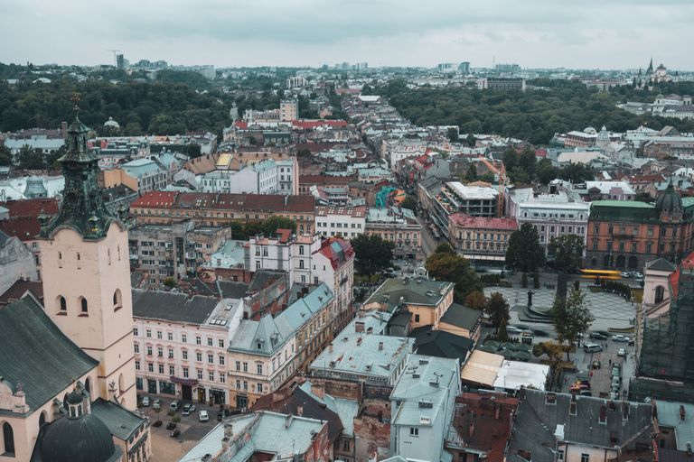 Aerial view of Lviv, Ukraine showcasing colorful rooftops and historic architecture.